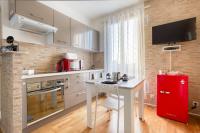 a kitchen with a red refrigerator and a table at Le Brooklyn sur Seine, T2 proche Paris in Vitry-sur-Seine