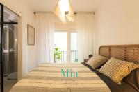 Postel nebo postele na pokoji v ubytování City and Beach Apartment