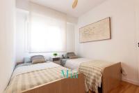 Postel nebo postele na pokoji v ubytování City and Beach Apartment