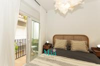 Postel nebo postele na pokoji v ubytování City and Beach Apartment