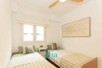 Postel nebo postele na pokoji v ubytování City and Beach Apartment
