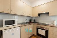 Kuchyň nebo kuchyňský kout v ubytování City and Beach Apartment