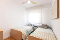 Postel nebo postele na pokoji v ubytování City and Beach Apartment