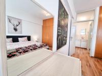 Postel nebo postele na pokoji v ubytování CityCenter Apartment
