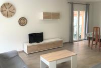 Televízia a/alebo spoločenská miestnosť v ubytovaní Apartament Centre Platja