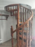 a wooden spiral staircase in a room at KATKA Karavas in Kythira