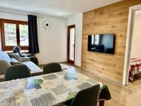 Televízia a/alebo spoločenská miestnosť v ubytovaní D'Hérens apartment