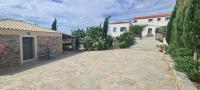 a stone driveway in front of a house at KATKA Karavas in Kythira