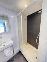 a bathroom with a shower and a sink at Residence OLit Cathédrale in Strasbourg