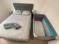 Katil atau katil-katil dalam bilik di Appartement Iban 1km des plages
