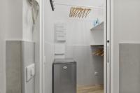 a bathroom with a washer and dryer in a room at Cannes NG - Appartement à 10 mn du Palais des Festivals in Cannes