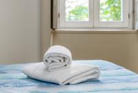 A bed or beds in a room at FEEL - Porta Nuova Rooms