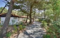 a path in front of a house with trees at 2 Bedroom Beautiful Home In La Faute-sur-mer in La Faute-sur-Mer