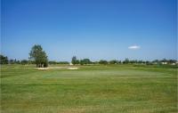 a view of the green at the golf course at 2 Bedroom Beautiful Home In La Faute-sur-mer in La Faute-sur-Mer