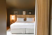 Ein Bett oder Betten in einem Zimmer der Unterkunft Les Sources de Caudalie