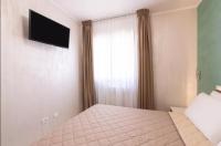 Posteľ alebo postele v izbe v ubytovaní Azzurra Apartments