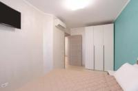 Posteľ alebo postele v izbe v ubytovaní Azzurra Apartments
