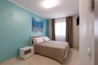 Posteľ alebo postele v izbe v ubytovaní Azzurra Apartments