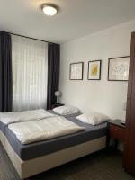 Postel nebo postele na pokoji v ubytování Apartments Gato Karlovy Vary Stara Role