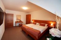 Łóżko lub łóżka w pokoju w obiekcie Golf&Wellness Resort Alfrédov