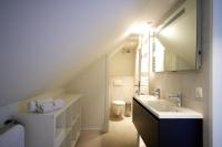 a bathroom with a sink and a toilet at Apartment with a view and parking in Brecht