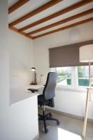 an office with a desk and a chair and a window at Apartment with a view and parking in Brecht