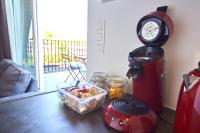 a table with a coffee maker and a container of food at Apartment with a view and parking in Brecht