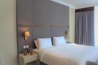 Ramada by Wyndham Doha Old Townにあるベッド