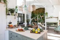 a kitchen with fruits and vegetables on a counter at Beautiful loft in the 20th district of Paris - Welkeys in Paris