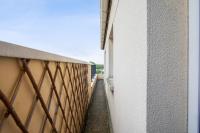 an alley between a building and a wall at Charming 2br a 2 steps from the Stade de France - Welkeys in Saint-Denis