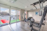 a gym with two treadmills and a treadmill at Appart’City Confort Tours in Tours
