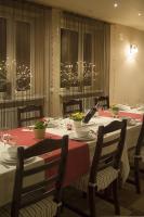 a dining room with a table with a red table cloth at HOTEL ŁABĘDY i Hostel Łabędy in Gliwice