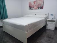 Postel nebo postele na pokoji v ubytování APARTAMENTO MAYI