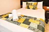 Hotel Colonial Playa del Carmenにあるベッド