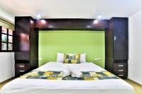 Hotel Colonial Playa del Carmenにあるベッド