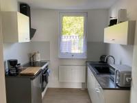 Kuchyň nebo kuchyňský kout v ubytování Schöne Ferienwohnung „Zum Glück Tropical“