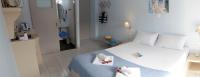 Posteľ alebo postele v izbe v ubytovaní Tasoula Guest House