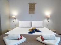 Posteľ alebo postele v izbe v ubytovaní Tasoula Guest House