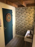 a room with a door and a wall with a wallpaper at Foyal City Center in Fort-de-France