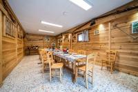 a dining room with a long table and chairs at Coeur de Charmy - 10 personnes in Abondance