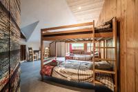 a bedroom with two bunk beds in a room at Coeur de Charmy - 10 personnes in Abondance