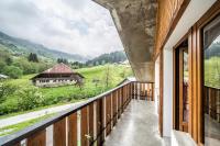 a balcony with a view of the mountains at Coeur de Charmy - 10 personnes in Abondance