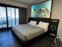 A bed or beds in a room at Bakour La Manga Splash