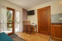 Televízia a/alebo spoločenská miestnosť v ubytovaní APARTAMENTY PASJA -2 minuty do plaży
