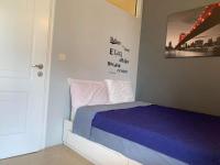 A bed or beds in a room at Corfu town Kanoni apartment