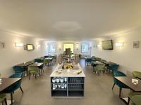 Televízia a/alebo spoločenská miestnosť v ubytovaní Hotel Hambros - Il Parco in Villa Banchieri