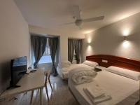 Posteľ alebo postele v izbe v ubytovaní Hostal la Embajada