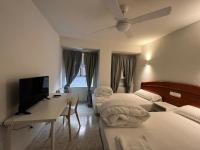 Posteľ alebo postele v izbe v ubytovaní Hostal la Embajada