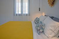 A bed or beds in a room at Alko Apartments