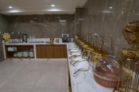 Kuchyň nebo kuchyňský kout v ubytování HOTEL STATURE INN